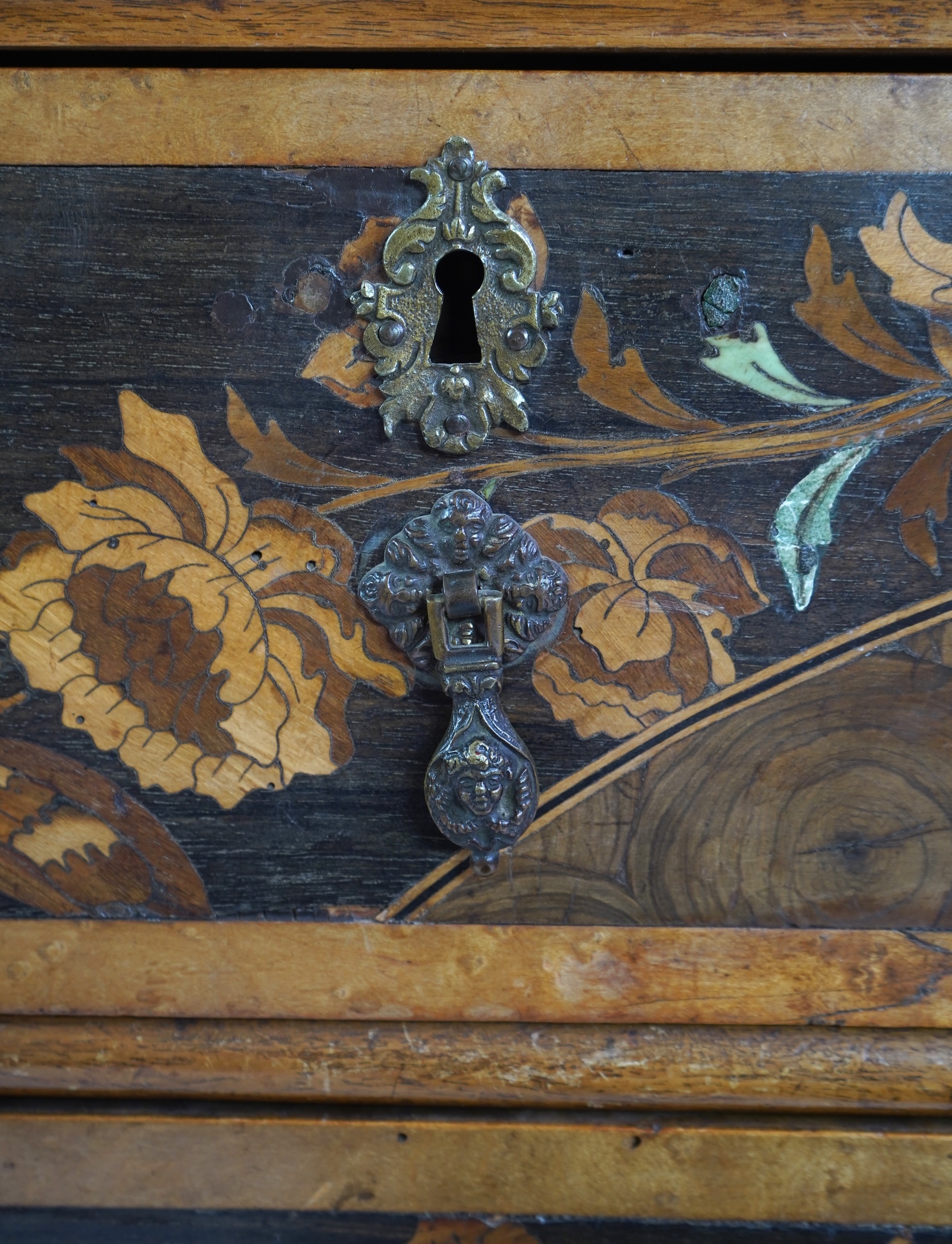 A William & Mary and later floral marquetry inlaid walnut chest